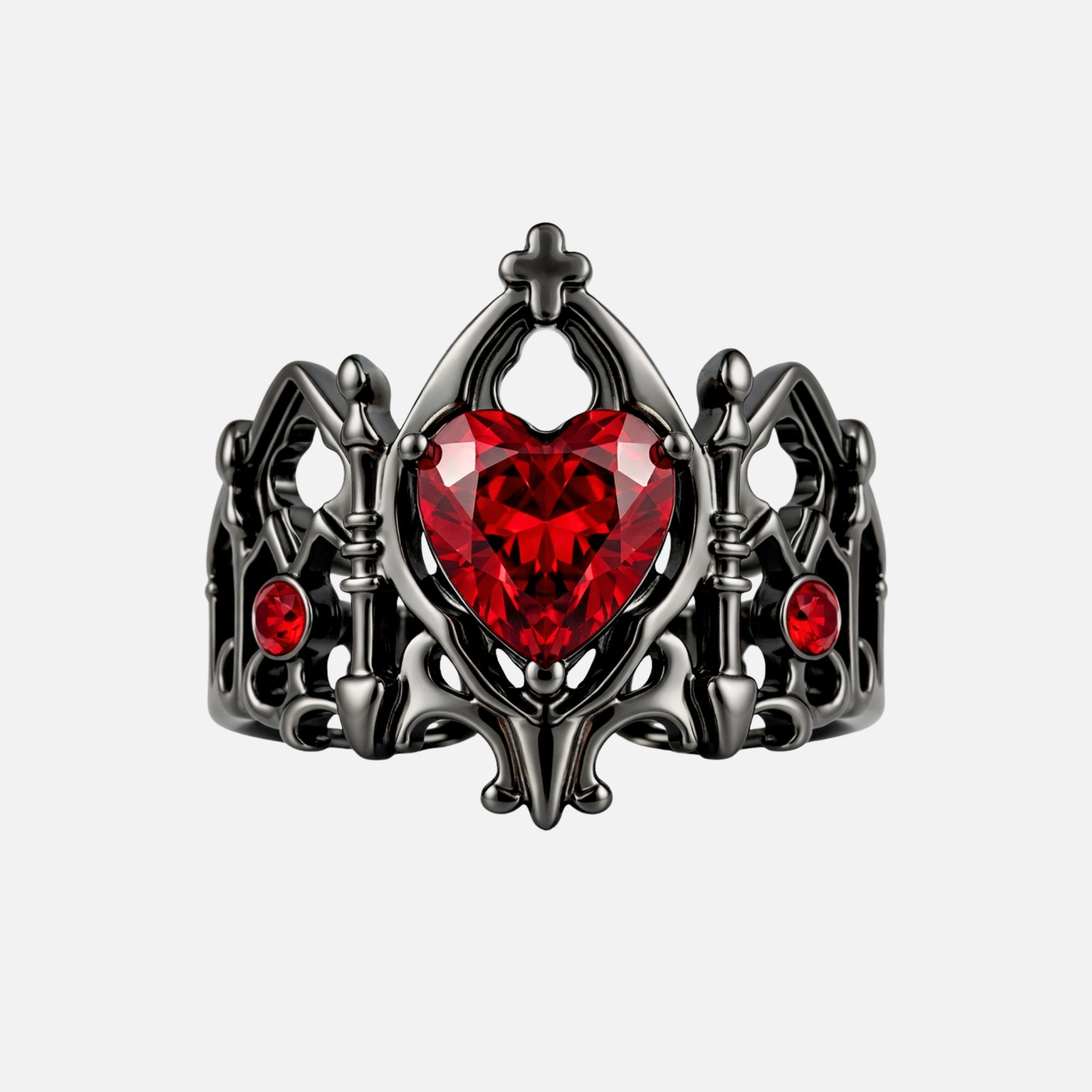 Devotion gothic cathedral heart ring in black metal with red zirconia heart stone, cross crown detail, and openwork arch band